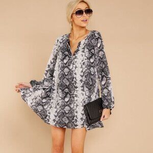 BNWT snakeskin long sleeve dress. Size Medium. Red dress boutique